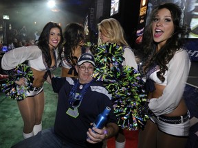 Myles Wilkinson, here partying with Seattle Seahawk cheerleaders, got to enjoy the Super Bowl despite being barred from attending the game in New Orleans due to overly zealous U.S. border rules thanks to Commodore Ballroom managers, who invited him to their party in Vancouver. (Mark van Manen/PNG FILES)