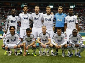The Vancouver Whitecaps' starting lineup poses before their season opener March 2, 2013 at B.C. Place Stadium.