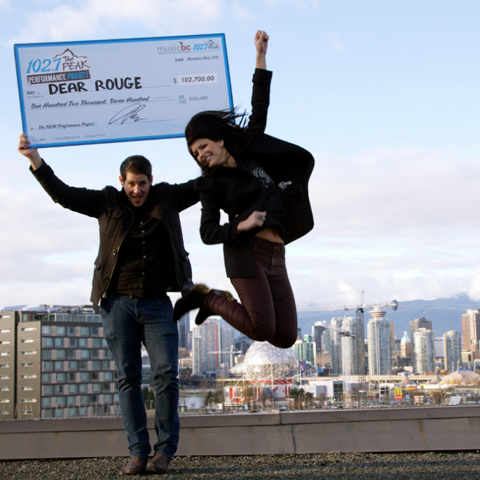 Drew and Danielle of Dear Rouge celebrate their win against Vancouver’s skyline. (CARMEN BRIGHT PHOTO)