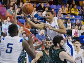 UBC's Jordan Jensen-Whyte collides with UFV's Sean Ashkenazy on his way to the hoop Friday night at War Gym in the opening game of the Canada West Final Four. (Bob Frid, UBC athletics)