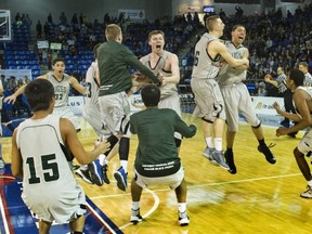 The Walnut Grove Gators celebrate winning the BC boys Triple A basketball title Saturday at the Langley Events Centre. (PNG photo)