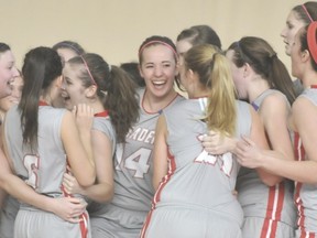 Tournament MVP Michelle Bos (14, centre) and the rest of Surrey’s Holy Cross Crusaders celebrate after winning the B.C. senior girls Double A basketball championships on March 9 in Kamloops. (Photo – Murray Mitchell, Kamloops Daily News)