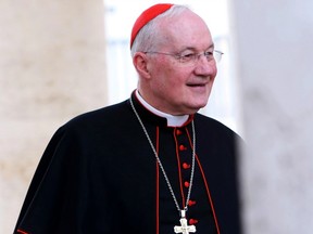Canadian cardinal Marc Ouellet leaves the final congregation Monday before the cardinals enter the conclave Tuesday, March 12, to vote for a new pope. (GETTY IMAGES)