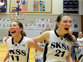 South Kamloops' senior stars Maya Olynyk (left) and Emma Wolfram leave the floor victorious following BC title game win over Brookswood on Saturday at the LEC. (Les Bazso, PNG)