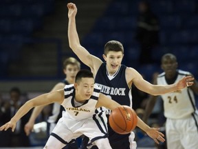 Kitsilano's Justin Sze (front) is guarded by WRCA's Tyus Allen in Final Four on Friday at LEC. (Gerry Kahrmann, PNG)