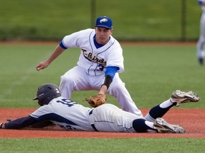 UBC's Andrew Firth attempts to put the tag on Corban University's Landon Frost during a play at third base Saturday at Thunderbird Stadium. The NAIA West collegiate baseball foes split a total of four games this weekend as UBC wrapped up the home portion of its 2013 season. (Richard Lam, UBC athletics).