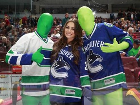 The Green Men and Sophie Tweed-Simmons at the Canucks-Blackhawks game April 22, 2013 at Rogers Arena in Vancouver. Photo by Jeff Vinnick -- Vancouver Canucks.