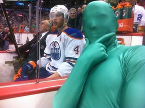 Sully of the Green Men enjoys being in the presence of the Edmonton Oilers' Taylor Hall on April 4, 2013 at a Canucks-Oilers game at Rogers Arena.