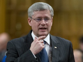 Prime Minister Stephen Harper responds to a question during question period in the House of Commons on Tuesday March 26, 2013. His government is being investigated for muzzling federal scientists. (THE CANADIAN PRESS FILES)