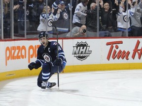 B.C. boy Andrew Ladd, the captain of the Winnipeg Jets, scored the shootout winner against the Tampa Bay Lightning on April 16, 2013 in Winnipeg. Getty Images file photo.