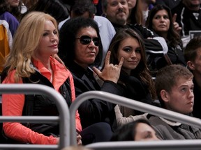 Gene Simmons, his daughter Sophie and wife Shannon Tweed take in a Canucks-Kings game in Los Angeles back in January. Getty Images photo.
