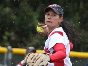SFU pitrcher Cara Lukawesky fielding her position in the rain Sunday against visiting St. Martin's at Beedie Field. (Ron Hole, SFU athletics)