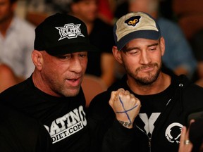 Why a picture of Mark Coleman and CM Punk? Because one is an under-appreciated pioneer and the other is "The Best in the World!" (photo by Josh Hedges / Zuffa LLC / Zuffa LLC for Getty Images)