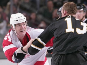 Detroit's Brad May and Dallas's Krys Barch fight in a 2009 NHL game. Getty Images file photo.