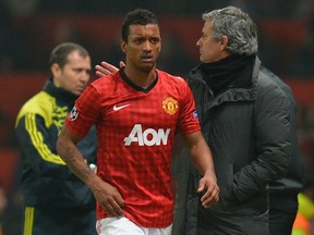 Real Madrid coach Jose Mourinho and Manchester United star Nani share a moment.