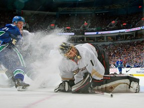 The Vancouver Canucks' Mason Raymond sprays Anaheim Ducks goalie Jonas Hiller April 25 at Rogers Arena. Getty Images photo.
