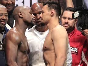 Mayweather (left) and Guerrero stand toe-to-toe at Friday's weigh-in. Photo: Mary Ann Owen