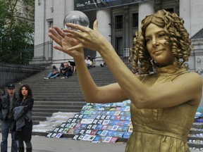 Dawn Monette, performing here Monday outside the Vancouver Art Gallery, is boycotting Granville Island over new busking rules. (Wayne Leidenfrost/PNG FILES)