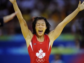 SFU's Carol Huynh in her golden moment for Canada at the 2008 Beijing Olympics. (PNG photo)