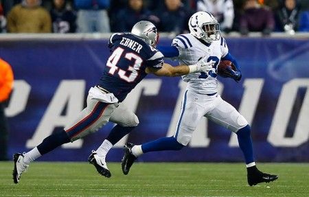 FOXBORO, MA - NOVEMBER 18: T.Y. Hilton #13 of the Indianapolis Colts runs with the ball while attempting to avoid being tackled by Nate Ebner #43 of the New England Patriots during the game on November 18, 2012 at Gillette Stadium in Foxboro, Massachusetts. (Photo by Jared Wickerham/Getty Images)