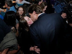 Vancouver-Point Grey NDP candidate David Eby celebrates his win over Premier Christy Clark by sharing a kiss with his girlfriend, Cailey Lynch. (Mark van Manen/PNG FILES)