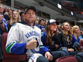 Glee stars Cory Monteith and Lea Michele watch Game One of the Western Conference Quarterfinals between the San Jose Sharks and the Vancouver Canucks during the 2013 NHL Stanley Cup Playoffs at Rogers Arena on May 1, 2013 in Vancouver.