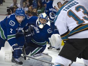 Roberto Luongo (centre) and Dan Hamhuis were among the Canucks' top four performers in the playoffs, according to your votes. (Steve Bosch/PNG)