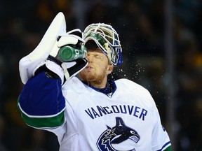 Canucks goalie Cory Schneider takes a much-needed break in Game 3 of their first-round playoff series against the San Jose Sharks on May 5, 2013. Getty Images photo.