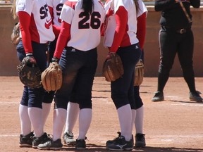 Simon Fraser Clan members convene in the pitcher's circle Thursday in 3-2 win over Western Oregon in Billings, Mont.