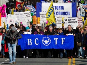 Recent court ruling upholding the right of unionized teachers to talk politics in schools isn’t sitting well with some readers. Here, B.C. Teachers Federation members march in a B.C. Federation of Labour rally at the legislature last year. (TIMES COLONIST FILES)