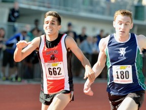 Ben Weir (right) of the Glenlyon Norfolk Gryphons, had just enough to edge Terry Fox's Nathan Wadhwani in the boys 3,000 metres final Friday in Langley. (PNG photo).