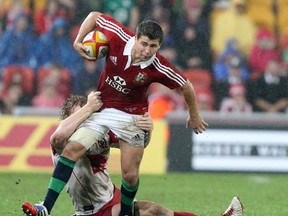 Ben Youngs of the Lions attacks during the rugby union tour match between the British and Irish Lions and the Queensland Reds in Brisbane, Australia, Saturday, June 8, 2013. (AP Photo/Tertius Pickard)