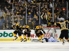 The Boston Bruins celebrate their game-7 overtime win over the Toronto Maple Leafs on May 13, 2013. Getty Images file photo.