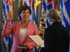 Christy Clark is sworn in as premier by Lt.-Gov. Judith Guichon at the legislature in Victoria on Monday. (THE CANADIAN PRESS FILES)