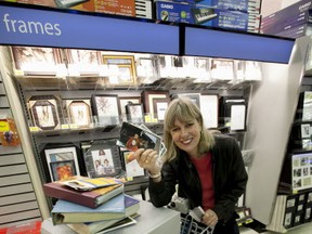 Digital Life reporter Gillian Shaw finds a one-stop solution to archiving photos digitally at London Drugs. (Mark Yuen/Vancouver Sun) [PNG Merlin Archive]