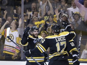 Patrice Bergeron and Milan Lucic of the Boston Bruins celebrate a goal during game 3 of the 2013 Stanley Cup final. Getty Images photo.