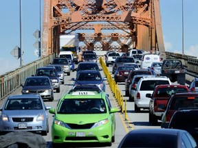 Many readers are not open to a new tax on road use or tolls on bridges to pay for transit expansion, saying that TransLink should live within its current means, which includes several taxes on auto use. (Mark van Manen/PNG FILES)