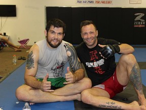 Robert Drysdale (left) taking a break from training with Canadian mixed martial artist Nabil Khatib.