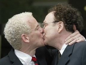 Michael Stark, left, and Michael Leshner kiss after their marriage in Ontario Superior Court in Toronto on Tuesday, June 10, 2003. (THE CANADIAN PRESS FILES)