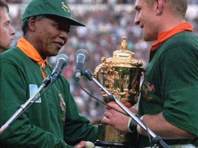 Nelson Mandela handed the William Webb Ellis Trophy to his victorious 1995 Springboks captain, Francois Pienaar (Associated Press)