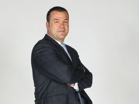 Tanned, fit and relaxed, Alain Vigneault looked comfortable Friday when introduced as the New York Rangers new head coach. (Getty Images via National Hockey League).