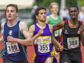 Glenlyon Norfolk School's Ben Weir (left) outkicks the field to win 1,500 metres on Saturday in Langley. (Les Bazso, PNG)