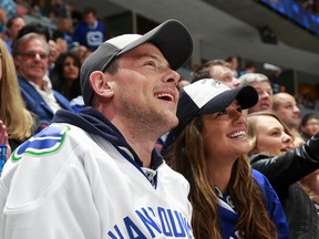 The late Cory Monteith takes in a Canucks game with his girlfriend Lea Michele at Rogers Arena during Game 1 of Vancouver's quarterfinal series against the San Jose Sharks earlier this year. (Getty Images)