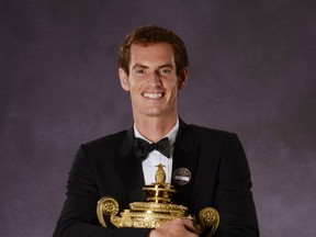 Andy Murray poses with his Wimbledon trophy on July 7, 2013 in London. Getty Images photo.