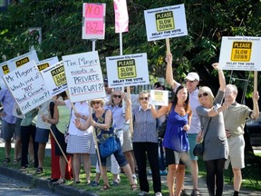 Many Vancouver residents, some here rallying in July against the closure of Point Grey Road, vow to unseat Vision in the next city election. (Mark van Manen/PNG)