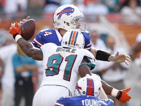Miami Dolphins' Cameron Wake goes after Buffalo Bills QB Ryan Fitzpatrick in December 2012. Getty Images file photo.