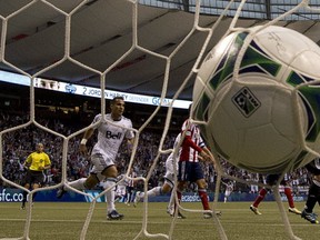 The Vancouver Whitecaps' Camilo Sanvezzo celebrates a goal against Chivas USA. Canadian Press photo.