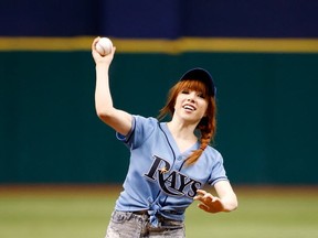 Carly Rae Jepsen throws out the first pitch at a Tampa Bay Rays game on July 14, 2013. Getty Images photo.