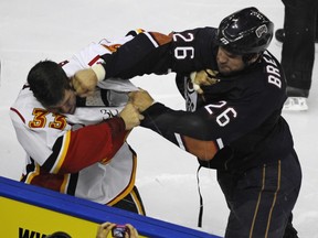 Colin Stuart took a right or two from the Oilers' Kip Brennan during the 2009-10 preseason. He went on to play for the Flames' farm team, the Abbotsford Heat, during the season.