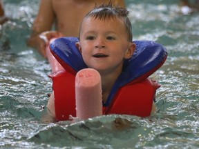 Hundreds of children, including this little otter, took the plunge at several pools in the World’s Largest Swimming Lesson on June 18 in Windsor, Ont. The global event was meant to combat drowning. (POSTMEDIA NEWS FILES)